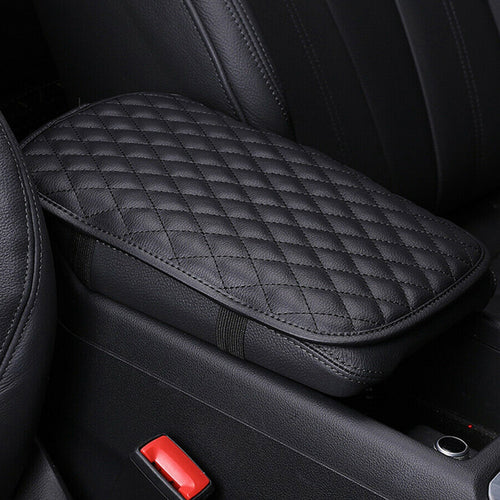Black quilted center console armrest cover installed in a vehicle