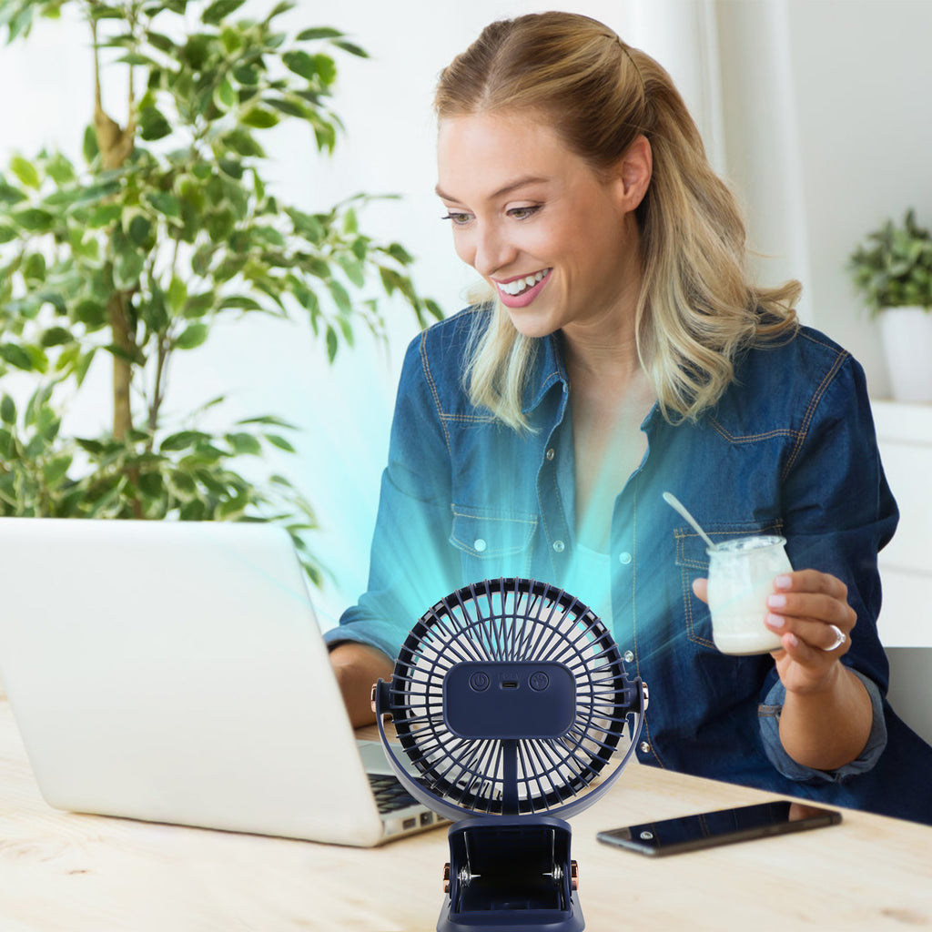 Blue fan used on a desk during a work break