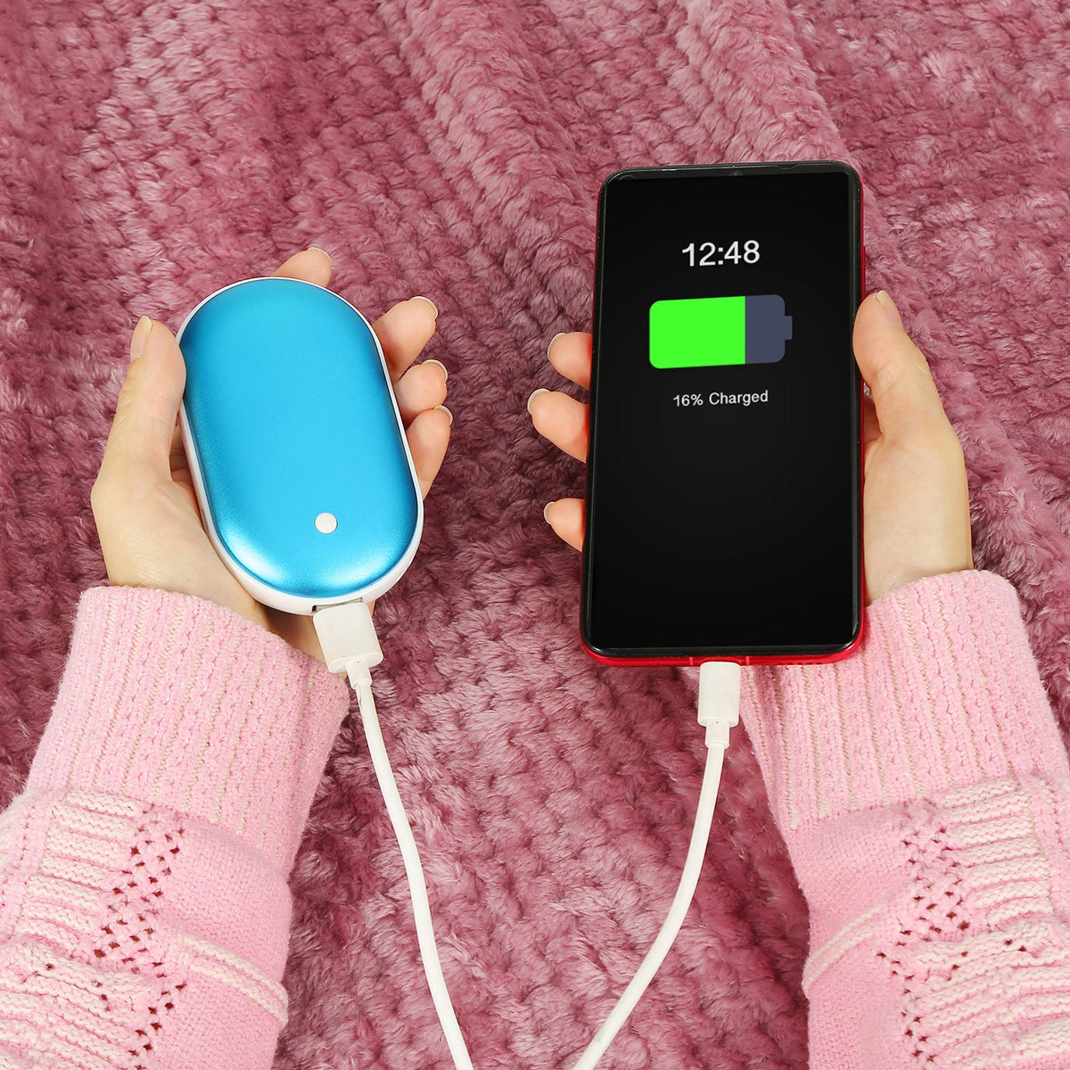 Blue portable power bank connected to a phone
