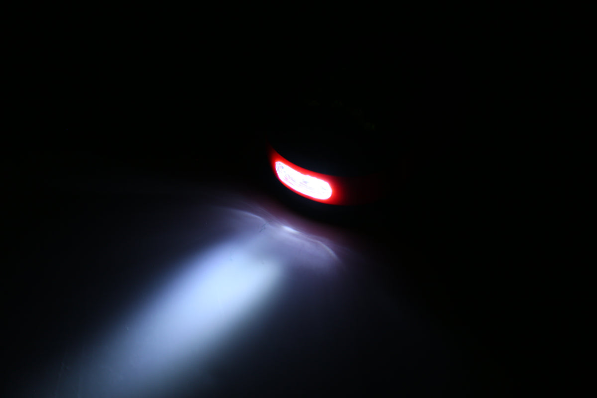Actual red work light illuminating in flashlight mode